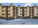 Exterior view of building with garages and snow at 246 Broken Lance Dr # 503, Breckenridge, CO 80424