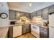 Efficient kitchen with gray cabinets and ample counter space at 246 Broken Lance Dr # 503, Breckenridge, CO 80424