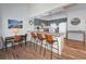 Kitchen with gray cabinets, breakfast bar, and wood floors at 246 Broken Lance Dr # 503, Breckenridge, CO 80424