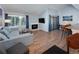 Cozy living room with sectional sofa, fireplace, and wood floors at 246 Broken Lance Dr # 503, Breckenridge, CO 80424