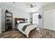 Cozy bedroom featuring a ceiling fan, TV, and large windows for natural light at 474 Black Feather Loop # 406, Castle Rock, CO 80104
