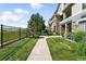 Beautiful condo exterior with manicured lawn and sidewalk access, offering a welcoming and well-maintained appearance at 474 Black Feather Loop # 406, Castle Rock, CO 80104