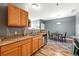 Kitchen area with oak cabinets, granite countertop and stainless steel appliances at 474 Black Feather Loop # 406, Castle Rock, CO 80104