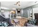 Inviting living room featuring wood floors, modern fixtures, and a decorative fireplace at 474 Black Feather Loop # 406, Castle Rock, CO 80104