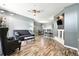 Spacious living room with hardwood floors, ceiling fan, and open layout, perfect for entertaining and relaxation at 474 Black Feather Loop # 406, Castle Rock, CO 80104