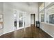 Modern lobby area featuring elegant flooring, natural light, and glass-paneled doors at 474 Black Feather Loop # 406, Castle Rock, CO 80104