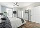 Comfortable bedroom featuring large windows, ceiling fan and en suite bathroom at 474 Black Feather Loop # 406, Castle Rock, CO 80104