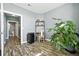 Bright office space featuring modern flooring, a workspace, and a large houseplant at 474 Black Feather Loop # 406, Castle Rock, CO 80104