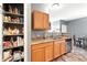 View of a kitchen pantry area with wood floors, cabinets and countertop at 474 Black Feather Loop # 406, Castle Rock, CO 80104