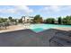 Inviting community pool with plenty of lounge chairs and landscaped features at 474 Black Feather Loop # 406, Castle Rock, CO 80104