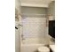 A well-lit bathroom features white subway tile in the shower and modern fixtures at 1040 Stuart St, Denver, CO 80204