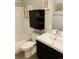 Bathroom features a modern sink and vanity, toilet, and tiled shower-tub combo at 1040 Stuart St, Denver, CO 80204