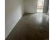 Bright living room with concrete floors and sliding glass doors to the backyard at 1040 Stuart St, Denver, CO 80204