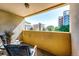 Private balcony with seating area and views of surrounding buildings and greenery at 1035 Colorado Blvd # 405, Denver, CO 80206