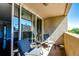 Balcony featuring a table and chairs with a view of city buildings and blue skies at 1035 Colorado Blvd # 405, Denver, CO 80206