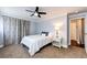 Bright bedroom with carpet, ceiling fan and view into closet and entry hall at 1035 Colorado Blvd # 405, Denver, CO 80206