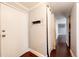 Bright entryway featuring hardwood floors, a white door, and access to the rest of the home at 1035 Colorado Blvd # 405, Denver, CO 80206