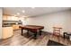 Game room features a pool table, kitchenette with sink, refrigerator, and ample cabinet space at 1035 Colorado Blvd # 405, Denver, CO 80206