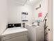 Efficient laundry room with modern, white, front-load washer and dryer for tenant convenience at 1035 Colorado Blvd # 405, Denver, CO 80206