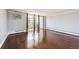The living room features a neutral paint scheme, hardwood floors, and access to the balcony at 1035 Colorado Blvd # 405, Denver, CO 80206