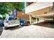 Ample parking available with easy access to the building, covered area, and mature trees at 1035 Colorado Blvd # 405, Denver, CO 80206