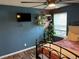 Bedroom with wood-look floors, a ceiling fan, and decor at 13962 E Stanford Cir # L07, Aurora, CO 80015