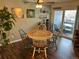 Dining area with a round table and a ceiling fan next to a sliding door at 13962 E Stanford Cir # L07, Aurora, CO 80015