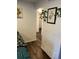 Hallway with wood floors, white walls, and decor at 13962 E Stanford Cir # L07, Aurora, CO 80015