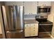 Bright, modern kitchen with stainless steel appliances, white cabinets, and subway tile backsplash at 13962 E Stanford Cir # L07, Aurora, CO 80015