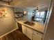 Kitchen featuring stainless steel appliances, white cabinets and concrete countertops plus breakfast nook at 13962 E Stanford Cir # L07, Aurora, CO 80015