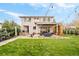 Beautiful backyard with an outdoor dining area and comfortable lounge seating at 2658 Wolff St, Denver, CO 80212