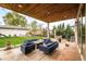 Great backyard space featuring outdoor furniture, a fire pit, and a well-manicured lawn at 2658 Wolff St, Denver, CO 80212