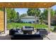 Grassy backyard featuring outdoor patio, fire pit, lounge seating and play set at 2658 Wolff St, Denver, CO 80212