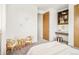 Comfortable bedroom with a cozy reading nook, a built-in desk and modern shelving at 2658 Wolff St, Denver, CO 80212