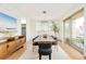 Elegant dining room with a large table, stylish chairs, and ample natural light at 2658 Wolff St, Denver, CO 80212