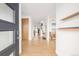 Bright foyer featuring wood floors, minimalist decor, and an open layout at 2658 Wolff St, Denver, CO 80212