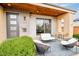 Inviting front porch with comfortable seating and a table, perfect for relaxing outdoors at 2658 Wolff St, Denver, CO 80212