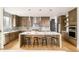 Modern kitchen featuring a large island, stainless steel appliances, and dark wood cabinetry at 2658 Wolff St, Denver, CO 80212