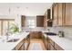 Spacious kitchen with stainless steel appliances, subway tile backsplash, and a functional island at 2658 Wolff St, Denver, CO 80212
