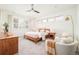 Serene bedroom with natural light, plantation shutters, and a contemporary ceiling fan at 2658 Wolff St, Denver, CO 80212