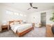 Inviting bedroom featuring a ceiling fan, light-filled windows, and stylish furnishings at 2658 Wolff St, Denver, CO 80212