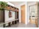 Convenient mudroom with built-in storage cubbies, bench seating, and coat hooks at 2658 Wolff St, Denver, CO 80212