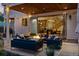 Contemporary outdoor patio features a fire pit, comfortable seating, and bi-fold doors opening to the home's interior at 2658 Wolff St, Denver, CO 80212