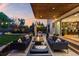 Inviting outdoor patio featuring modern furniture, fire pit, string lights, and access to the home's stylish interior at 2658 Wolff St, Denver, CO 80212