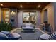 Inviting covered porch features an outdoor seating area with stylish furniture and decor at 2658 Wolff St, Denver, CO 80212
