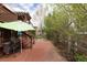 Cozy backyard patio with a grill and an umbrella for shaded outdoor dining at 3472 Harvard Pl, Broomfield, CO 80023
