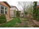 Fenced backyard with a lawn, trees, and a split rail fence at 3472 Harvard Pl, Broomfield, CO 80023