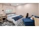Comfortable bedroom with a plush bed, cozy seating area, and soft lighting at 3472 Harvard Pl, Broomfield, CO 80023