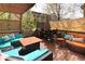 Inviting outdoor deck featuring comfortable seating, a fire pit, and a dining area, perfect for entertaining at 3472 Harvard Pl, Broomfield, CO 80023