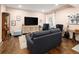 Beautiful living room with elegant decor, including a plush sofa and unique display cabinet at 3472 Harvard Pl, Broomfield, CO 80023